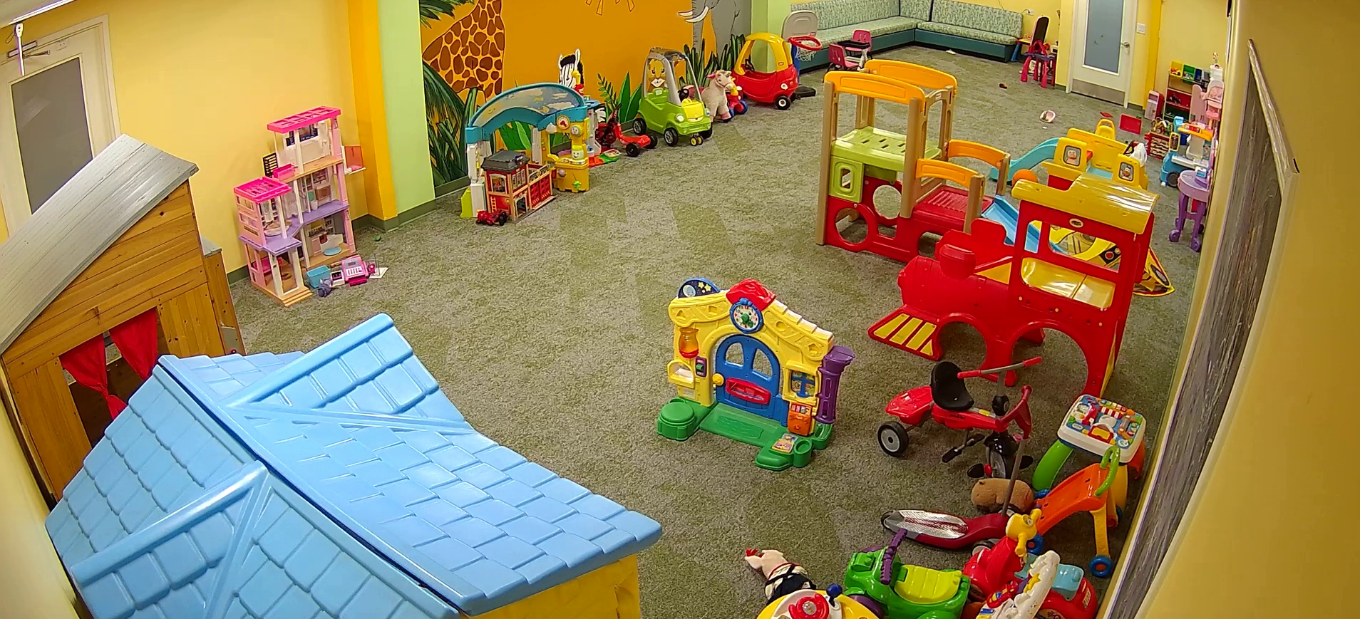 Children playing in an indoor kids club room