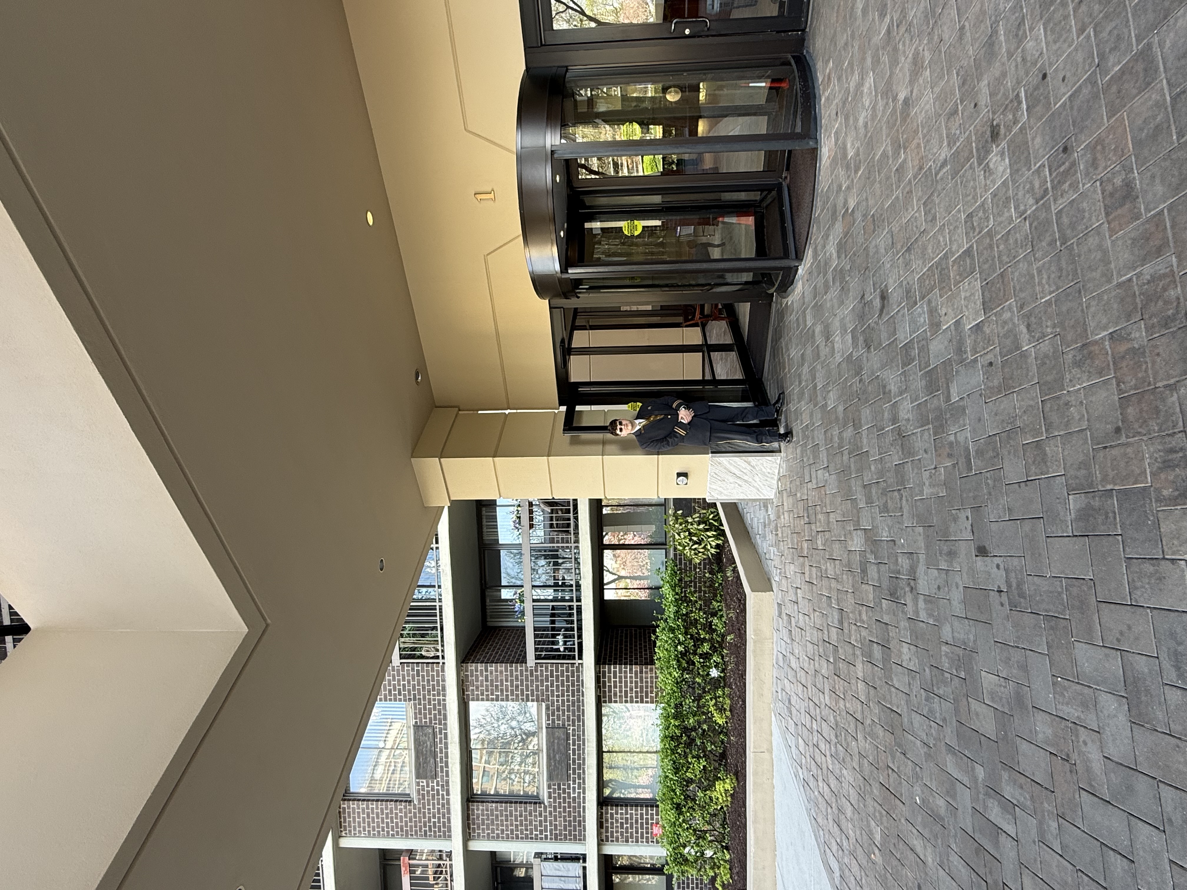 Doorman welcoming residents at The Bay Club entry