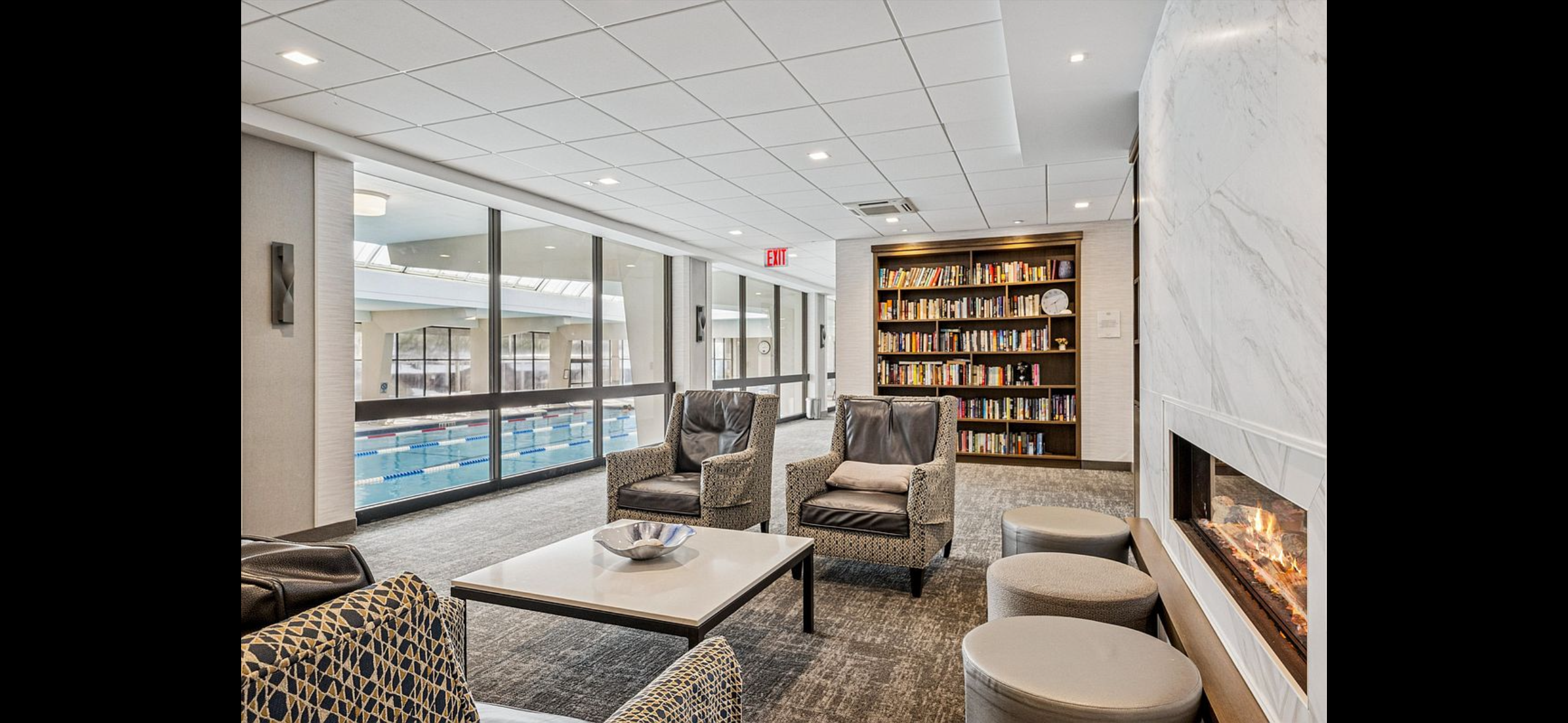 Library room with seating and bookshelves