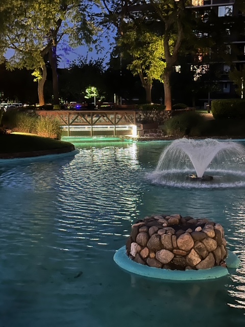 Landscaped pond and walking paths at The Bay Club