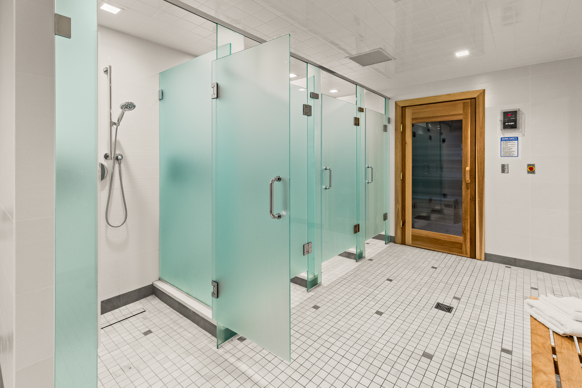 Locker room showers with tiled finishes